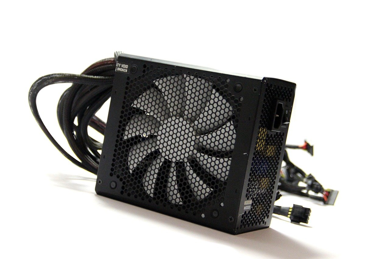 A computer power supply unit with all its cables.
